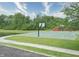 Community basketball court with walking path, trees, and a pond on the property at 2615 Pumpkin Patch Ln, Indianapolis, IN 46229