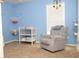 Comfortable Bedroom with glider, changing table, and charming decor at 2615 Pumpkin Patch Ln, Indianapolis, IN 46229
