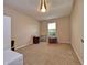 Cozy bedroom with neutral walls and a bright window overlooking the yard at 2615 Pumpkin Patch Ln, Indianapolis, IN 46229