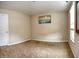 Neutral bedroom features carpet, white trim, and natural lighting at 2615 Pumpkin Patch Ln, Indianapolis, IN 46229