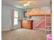 Unique bedroom with playful lofted bed and colorful wall accents at 2615 Pumpkin Patch Ln, Indianapolis, IN 46229