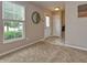 Inviting entryway featuring neutral colors, a tiled floor, and a decorative mirror at 2615 Pumpkin Patch Ln, Indianapolis, IN 46229