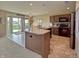 Well-lit kitchen features a center island and sliding door access to the backyard at 2615 Pumpkin Patch Ln, Indianapolis, IN 46229