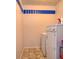 A bright laundry room is equipped with essential appliances at 2615 Pumpkin Patch Ln, Indianapolis, IN 46229