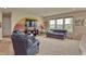 Inviting living room with natural light, carpet floors, and modern furnishings at 2615 Pumpkin Patch Ln, Indianapolis, IN 46229