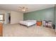 Bright and spacious main bedroom featuring neutral walls, ceiling fan, and a walk-in closet at 2615 Pumpkin Patch Ln, Indianapolis, IN 46229