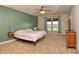 Inviting main bedroom featuring a ceiling fan, neutral decor, and scenic views at 2615 Pumpkin Patch Ln, Indianapolis, IN 46229
