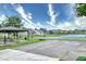 Community park includes a covered picnic area, basketball court, and walking path near the pond at 2615 Pumpkin Patch Ln, Indianapolis, IN 46229