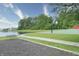 Community park offers a walking path, a basketball court, a bench, and views of the adjacent pond at 2615 Pumpkin Patch Ln, Indianapolis, IN 46229