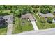 Aerial view of a well-maintained home with lush landscaping, a long driveway, and a two-car garage at 272 N Peterman Rd, Greenwood, IN 46142