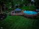 A backyard featuring a gazebo and a pool surrounded by lush greenery at 272 N Peterman Rd, Greenwood, IN 46142