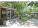 Backyard featuring stone patio with screened-in porch, beautiful landscaping, and gazebo at 272 N Peterman Rd, Greenwood, IN 46142