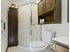 Bathroom featuring a walk-in shower, a toilet, and a dark wood cabinet at 272 N Peterman Rd, Greenwood, IN 46142