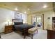 Bedroom featuring a dark wood bed, neutral walls, a ceiling fan, and sliding door to the patio at 272 N Peterman Rd, Greenwood, IN 46142
