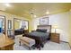 This bedroom features a mirrored closet, ceiling fan, and decorative ceiling at 272 N Peterman Rd, Greenwood, IN 46142