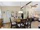 Inviting dining room featuring an oval table, pendant lighting, and hardwood floors, perfect for Gathering gatherings at 272 N Peterman Rd, Greenwood, IN 46142