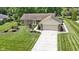 Lovely single-story home with a brick facade, attached garage, and well-manicured front yard at 272 N Peterman Rd, Greenwood, IN 46142