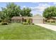 Beautiful home with lush green lawn, artistic landscaping, and front-facing two-car garage at 272 N Peterman Rd, Greenwood, IN 46142