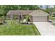 Classic brick home with a well-manicured lawn, tasteful landscaping, and an attached garage at 272 N Peterman Rd, Greenwood, IN 46142