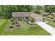 Traditional brick home featuring manicured landscaping, spacious lawn, and attached garage at 272 N Peterman Rd, Greenwood, IN 46142