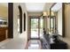 Bright foyer with hardwood floors, a decorative console table, and an open view to the outdoors at 272 N Peterman Rd, Greenwood, IN 46142