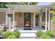 Inviting front porch with seating, charming decor, and a well-maintained entryway creating a warm welcome at 272 N Peterman Rd, Greenwood, IN 46142