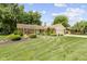 Charming single-story home featuring a well-manicured lawn, mature trees, and inviting curb appeal at 272 N Peterman Rd, Greenwood, IN 46142