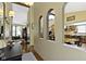 Hallway with wood floors, three archways, and an open floor plan view to a dining and living room at 272 N Peterman Rd, Greenwood, IN 46142
