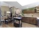 Open concept eat-in kitchen with a granite-topped island, and skylight above at 272 N Peterman Rd, Greenwood, IN 46142