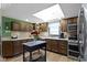 Bright kitchen with a central island, ample counter space, stainless appliances, and modern lighting at 272 N Peterman Rd, Greenwood, IN 46142