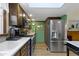 Spacious kitchen with stainless steel appliances, ample counter space, and a view to the backyard at 272 N Peterman Rd, Greenwood, IN 46142