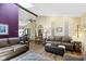 Bright and inviting living area with wood floors, and a ceiling fan at 272 N Peterman Rd, Greenwood, IN 46142