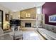 Inviting living room with a brick fireplace, built-in shelving, and comfortable seating arrangement at 272 N Peterman Rd, Greenwood, IN 46142