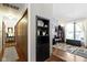 Cozy living space showcasing built-in shelving, hardwood floors, and natural light from the window at 272 N Peterman Rd, Greenwood, IN 46142