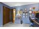 Cozy office space featuring blue walls, neutral carpet, storage cabinet, and a gallery wall of photos and certificates at 272 N Peterman Rd, Greenwood, IN 46142