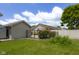 This home features a spacious backyard with a fence, grass, and a shed at 2872 N Prairie Stream Way, Columbus, IN 47203