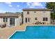 Spacious backyard featuring a sparkling pool, patio area, and well-maintained landscaping, ideal for outdoor living at 2872 N Prairie Stream Way, Columbus, IN 47203
