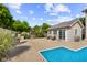Inviting backyard with a refreshing pool, a large patio, and lush greenery creating a tranquil outdoor space at 2872 N Prairie Stream Way, Columbus, IN 47203