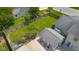 Aerial shot of a fenced backyard featuring a spacious lawn and a pool house with patio seating at 2872 N Prairie Stream Way, Columbus, IN 47203