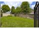 Fenced backyard with a well-maintained lawn, providing privacy and space for outdoor activities at 2872 N Prairie Stream Way, Columbus, IN 47203