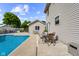 Backyard featuring a sparkling pool, patio with outdoor seating, and well-maintained landscaping, perfect for enjoying the outdoors at 2872 N Prairie Stream Way, Columbus, IN 47203