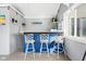 Charming bar area with seating, lighting, and beach-themed decor, perfect for entertaining guests at 2872 N Prairie Stream Way, Columbus, IN 47203