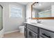Well-lit bathroom featuring a gray vanity, framed mirror and shower/tub combo, providing a relaxing and functional space at 2872 N Prairie Stream Way, Columbus, IN 47203