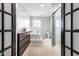 Bright, tiled bathroom featuring a soaking tub and walk-in shower, for a luxurious and comfortable experience at 2872 N Prairie Stream Way, Columbus, IN 47203