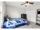 Cozy bedroom with carpet, ceiling fan, closet, and bed, offering a comfortable and inviting space at 2872 N Prairie Stream Way, Columbus, IN 47203