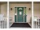 Close-up of the home's front door, featuring sidelights, decorative accents, and a welcoming ambiance at 2872 N Prairie Stream Way, Columbus, IN 47203