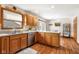 Bright kitchen with stainless steel appliances, oak cabinets and a breakfast nook at 2872 N Prairie Stream Way, Columbus, IN 47203