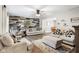 Open-concept living area with modern furnishings, hardwood floors, and a stylish accent wall at 2872 N Prairie Stream Way, Columbus, IN 47203
