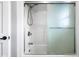 A bright shower/tub combo with glass doors. Modern fixtures and a clean design offer a luxurious bathing experience at 2872 N Prairie Stream Way, Columbus, IN 47203