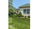 Backyard featuring lush lawn and mature landscaping at 3354 Nottinghill Dr, Plainfield, IN 46168
